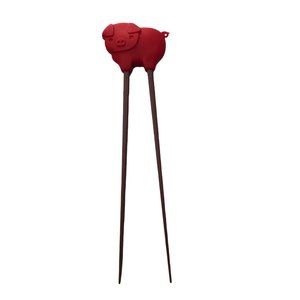Red Silicone Pig Brown Chopsticks Kids Practice by Talisman Designs.  Red